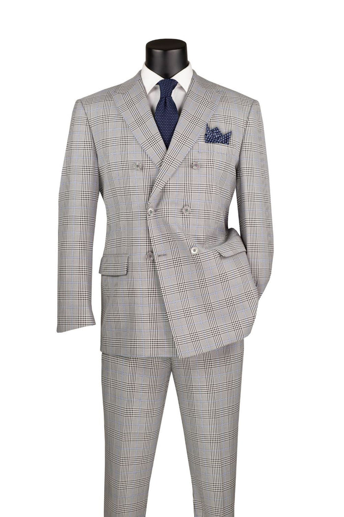 A mannequin showcases a Vinci Suits' Regular Fit Double Breasted 2 Piece Suit in Tone on Tone Windowpane Gray, paired with a white shirt and navy tie. The ensemble is complemented by flat front pants and a matching pocket square.