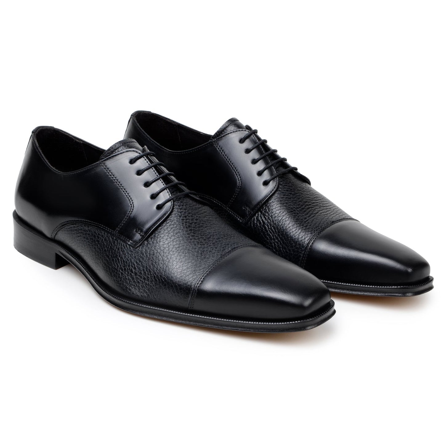 The BELVEDERE Alexander is a black men's dress shoe made of genuine Italian deerskin and calf, featuring a cap toe, lace-up closure, and low heel. Handcrafted in Brazil, shown in side profile on a white background.