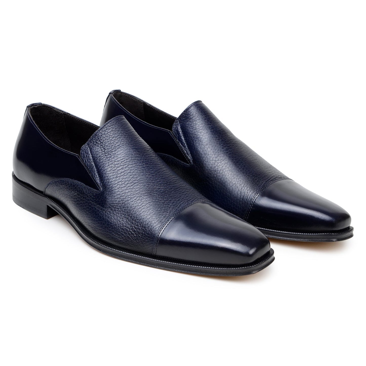 The BELVEDERE Belvedere - Andreo is a navy genuine Italian deerskin and calf slip-on dress shoe, shown in profile with smooth/textured finishes and a low heel against a white background.