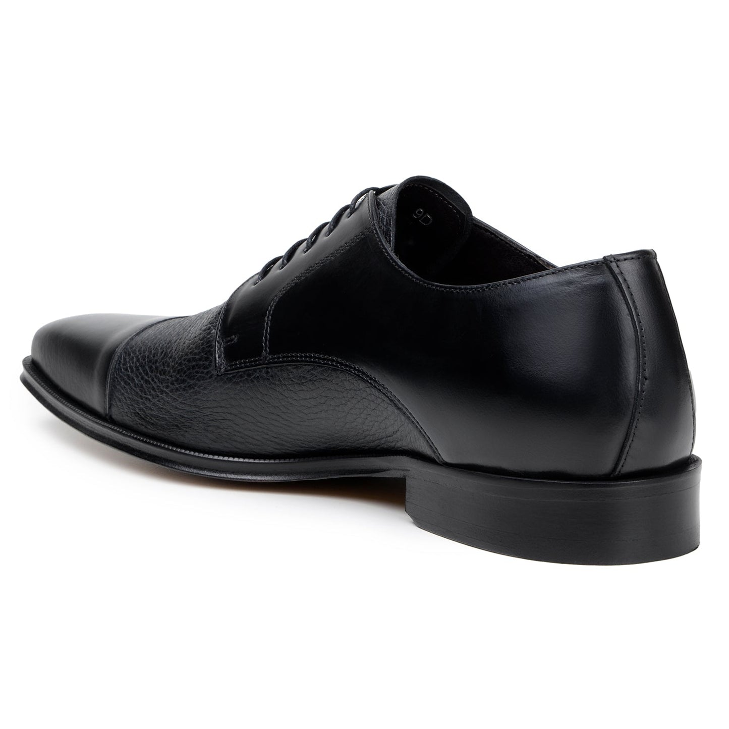 The BELVEDERE Alexander is a black men's dress shoe made of genuine Italian deerskin and calf, featuring a cap toe, lace-up closure, and low heel. Handcrafted in Brazil, shown in side profile on a white background.