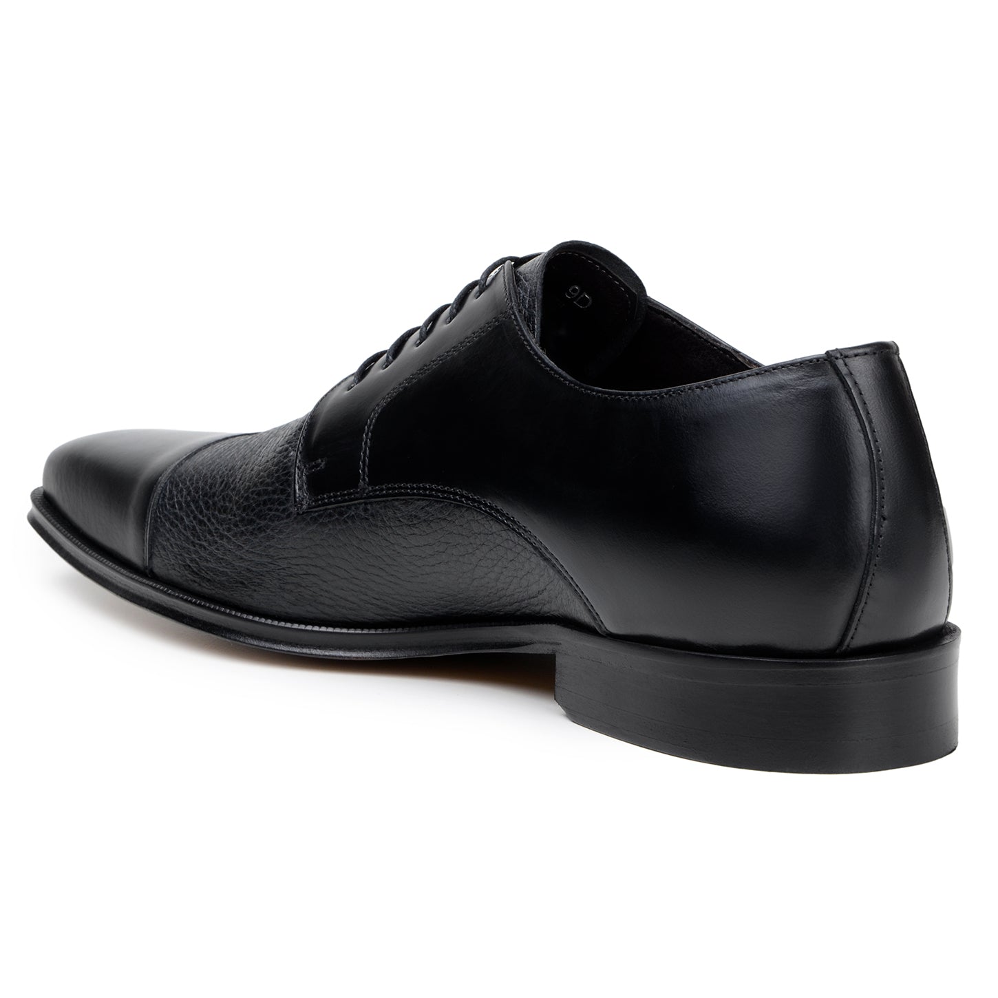The BELVEDERE Alexander is a black men's dress shoe made of genuine Italian deerskin and calf, featuring a cap toe, lace-up closure, and low heel. Handcrafted in Brazil, shown in side profile on a white background.