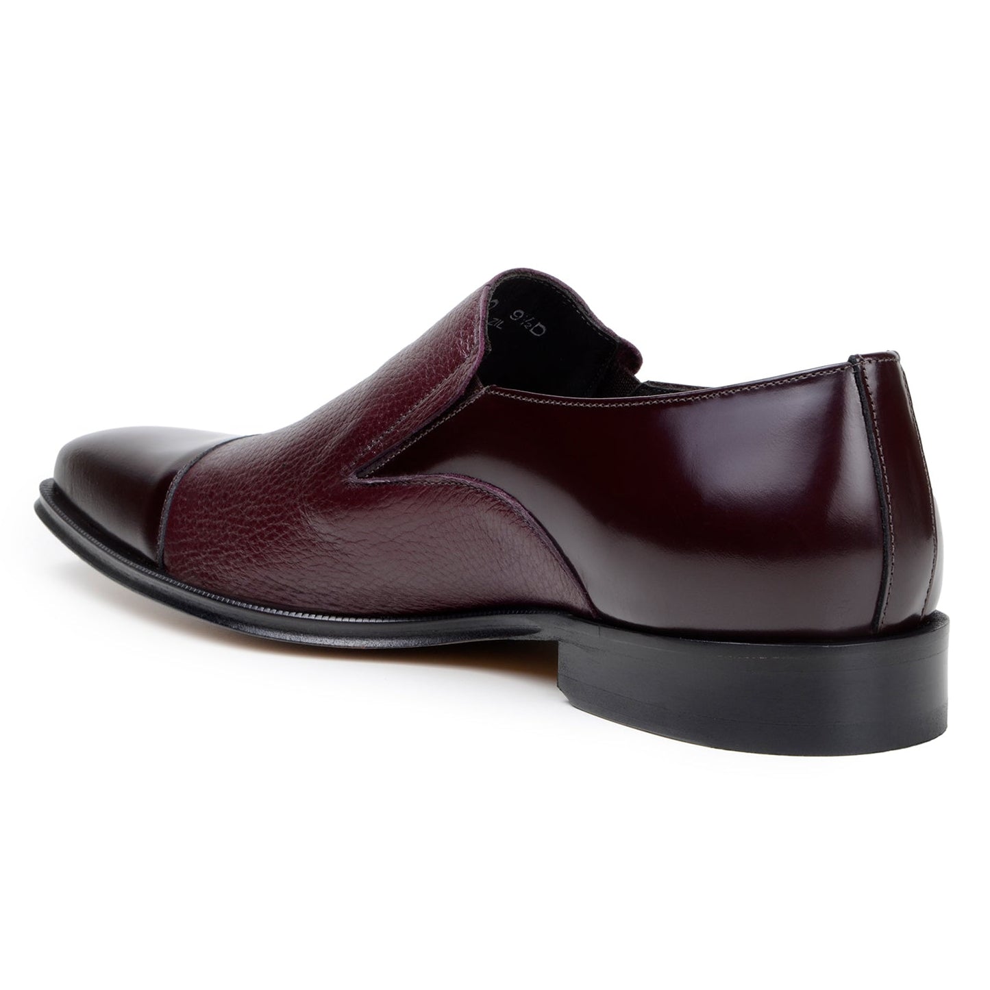 The BELVEDERE Andreo is a genuine Italian deerskin and calf burgundy dress shoe, featuring a slip-on design, low black heel, and mixed smooth-textured finishes—crafted for style and comfort.