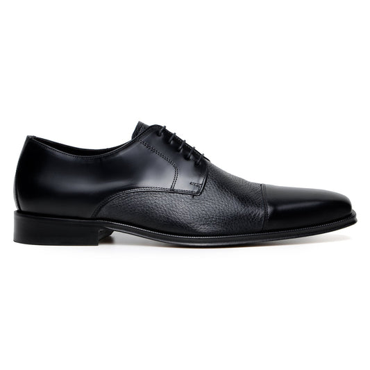 The BELVEDERE Alexander is a black men's dress shoe made of genuine Italian deerskin and calf, featuring a cap toe, lace-up closure, and low heel. Handcrafted in Brazil, shown in side profile on a white background.