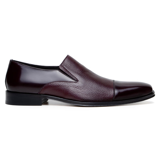 The BELVEDERE Andreo is a genuine Italian deerskin and calf burgundy dress shoe, featuring a slip-on design, low black heel, and mixed smooth-textured finishes—crafted for style and comfort.