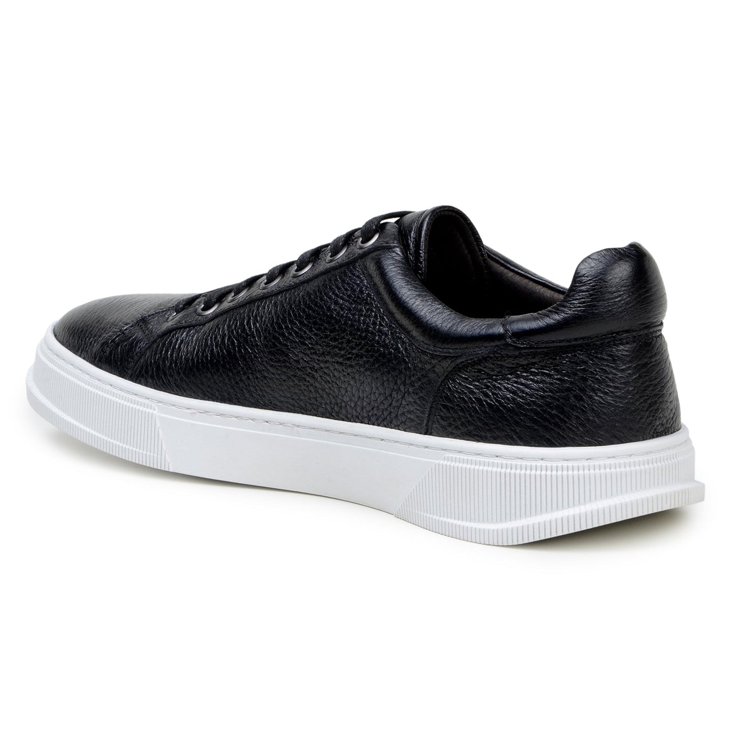 The BELVEDERE Matteo is a black genuine deerskin leather low-top sneaker with black laces, a white rubber sole, and cushioned insole, pictured in side profile against a plain white background.