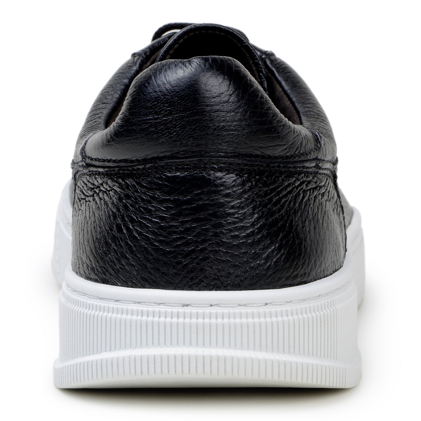 The BELVEDERE Matteo is a black genuine deerskin leather low-top sneaker with black laces, a white rubber sole, and cushioned insole, pictured in side profile against a plain white background.