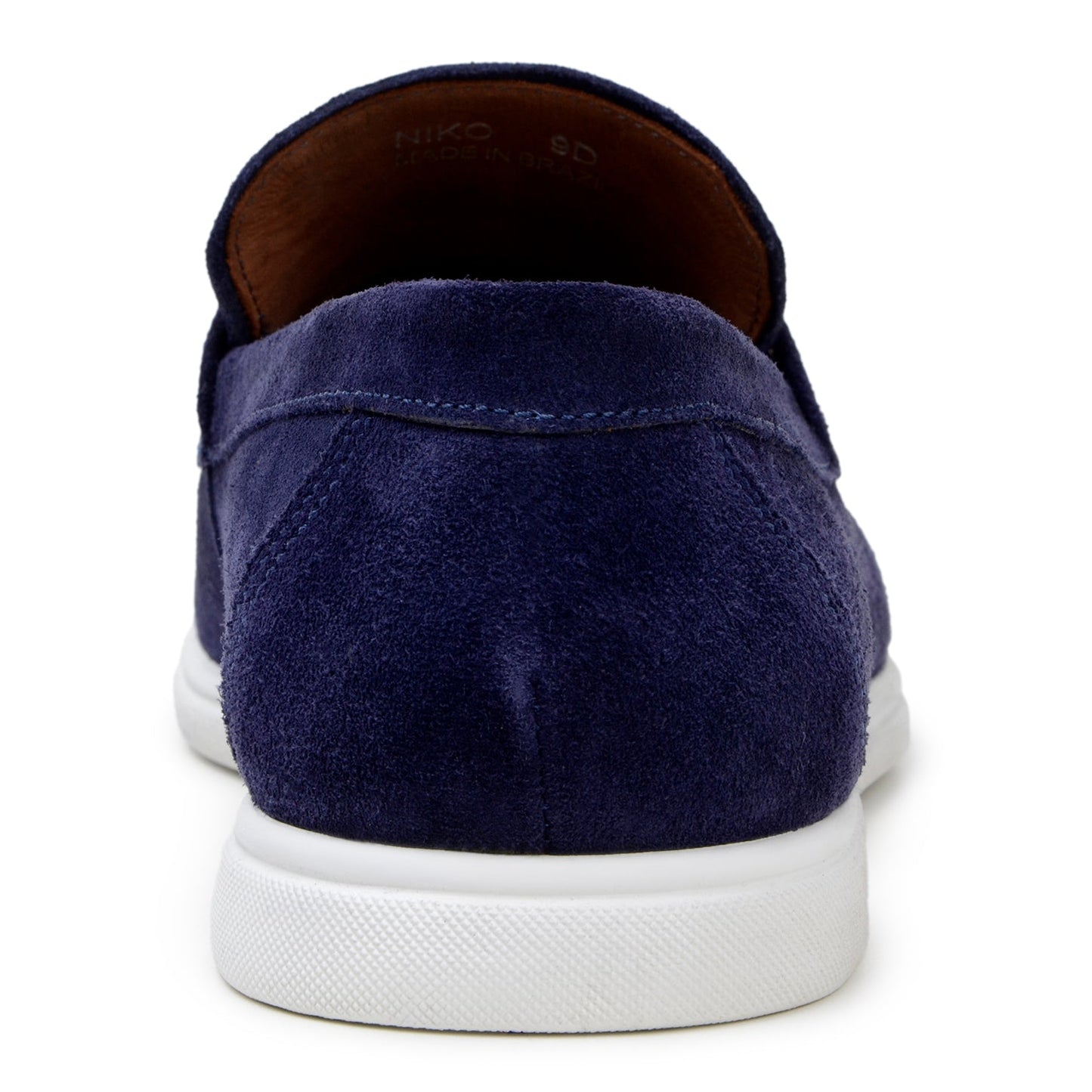 The BELVEDERE Niko is a men's penny loafer in navy Italian suede with hand-stitching and a white rubber sole, shown in side profile against a white background.