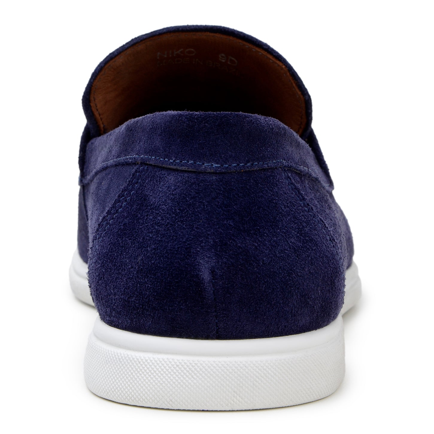 The BELVEDERE Niko is a men's penny loafer in navy Italian suede with hand-stitching and a white rubber sole, shown in side profile against a white background.