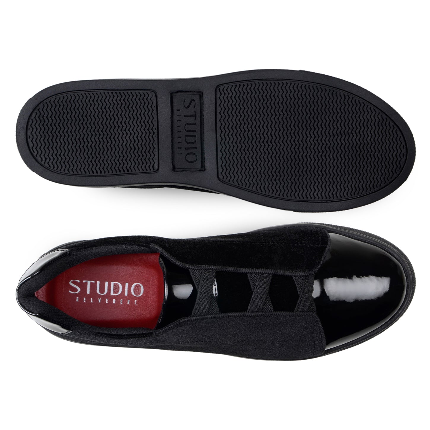 The BELVEDERE Belvedere - Silvano is a black low-top sneaker featuring velvet and patent leather uppers, glossy toe caps, and black soles, shown against a white background.