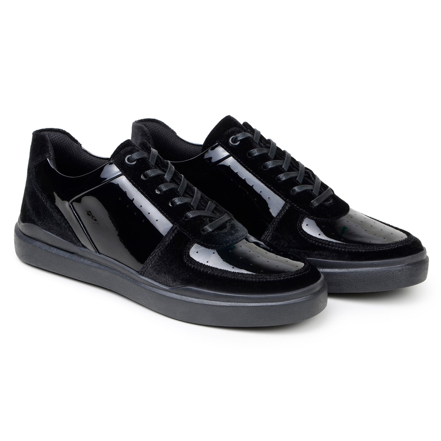 The BELVEDERE Edmound is a black low-top sneaker in patent leather and velvet, featuring glossy side panels, matte suede accents, black laces, and a rubber sole. Available in size 9.5 and 11.5 only. IN STORE FINAL SALE.