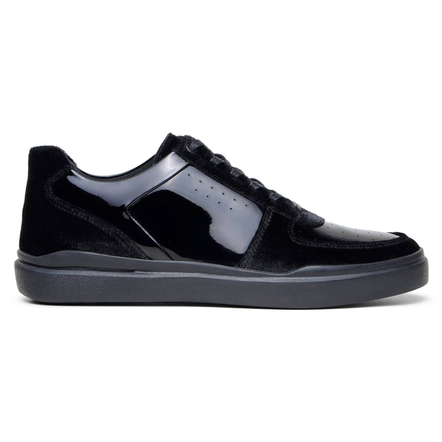 The BELVEDERE Edmound is a black low-top sneaker in patent leather and velvet, featuring glossy side panels, matte suede accents, black laces, and a rubber sole. Available in size 9.5 and 11.5 only. IN STORE FINAL SALE.