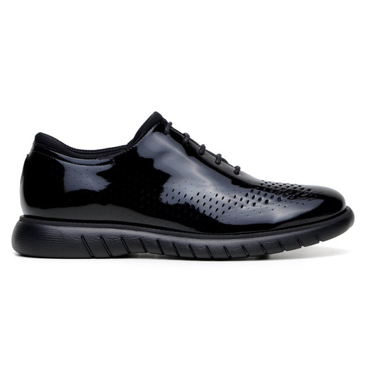 The BELVEDERE Belvedere - Maxim Laser Cut Wingtip Sneaker in black features shiny patent leather, perforated sides, wingtip detailing, and a textured rubber sole, shown in side profile on a white background.