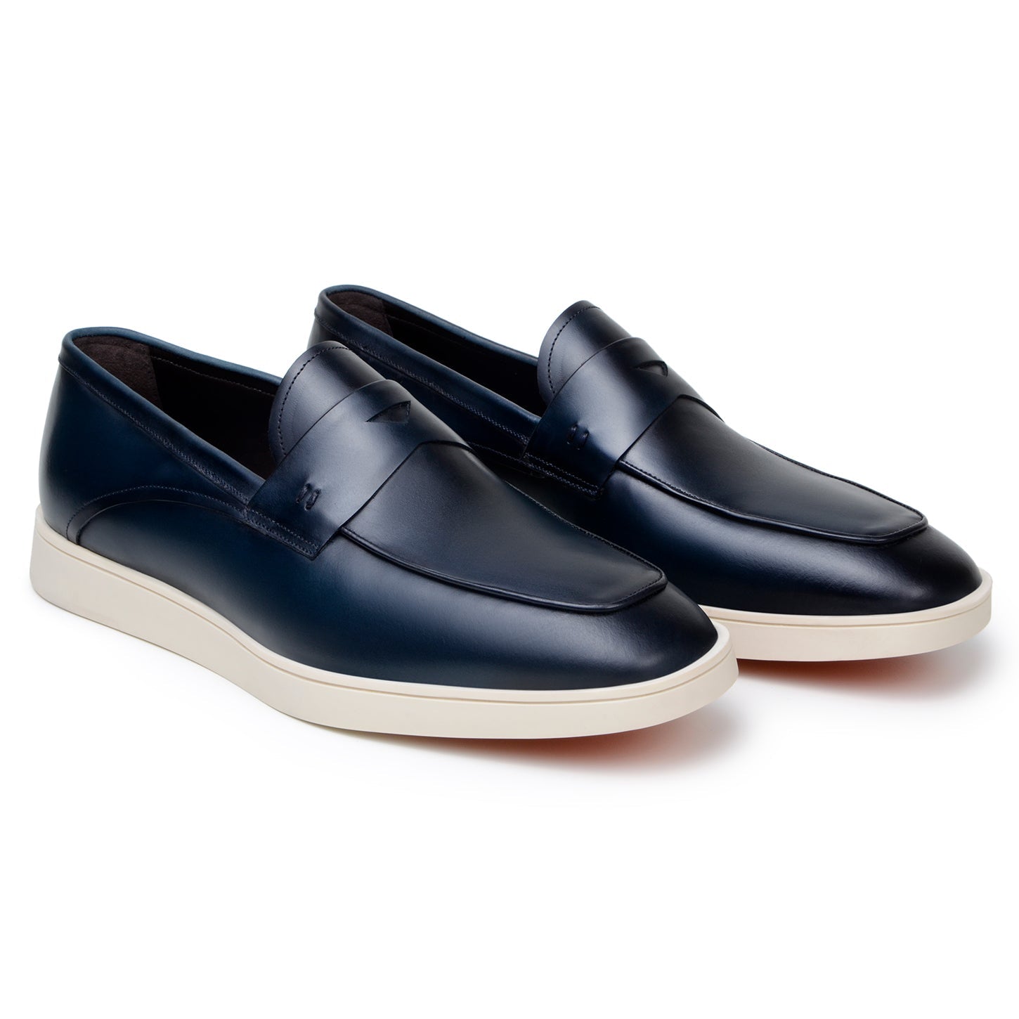 The BELVEDERE Belvedere - Maurizio Hybrid Penny Loafer Shoe in navy Nappa leather features a white rubber sole. Photographed from the side on a white background. Made in Brazil.