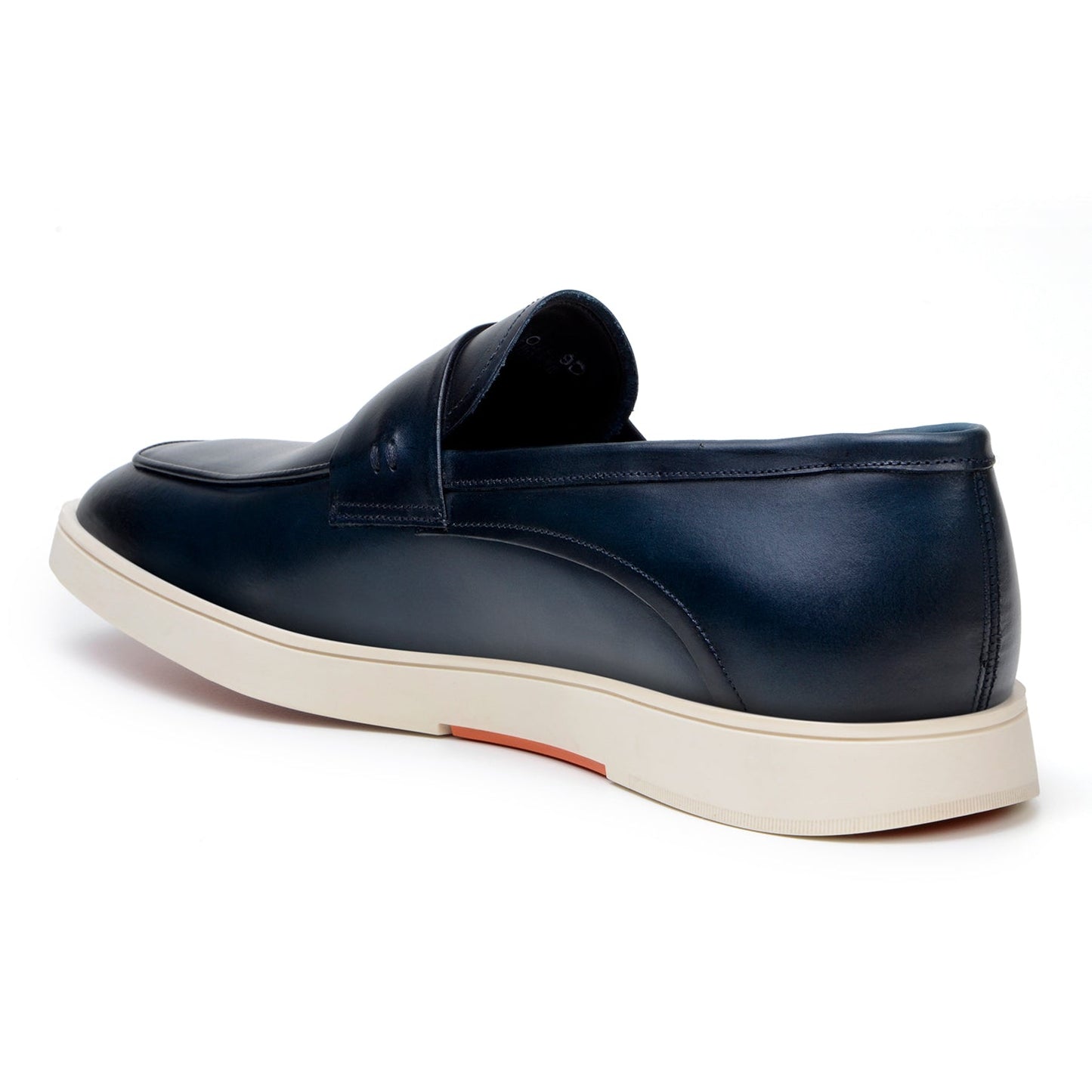 The Belvedere - Maurizio, Hybrid Penny Loafer Dress Shoe in Navy by BELVEDERE is a pair of Nappa leather slip-on shoes with white soles and a cushioned insole, viewed from a slight angle.