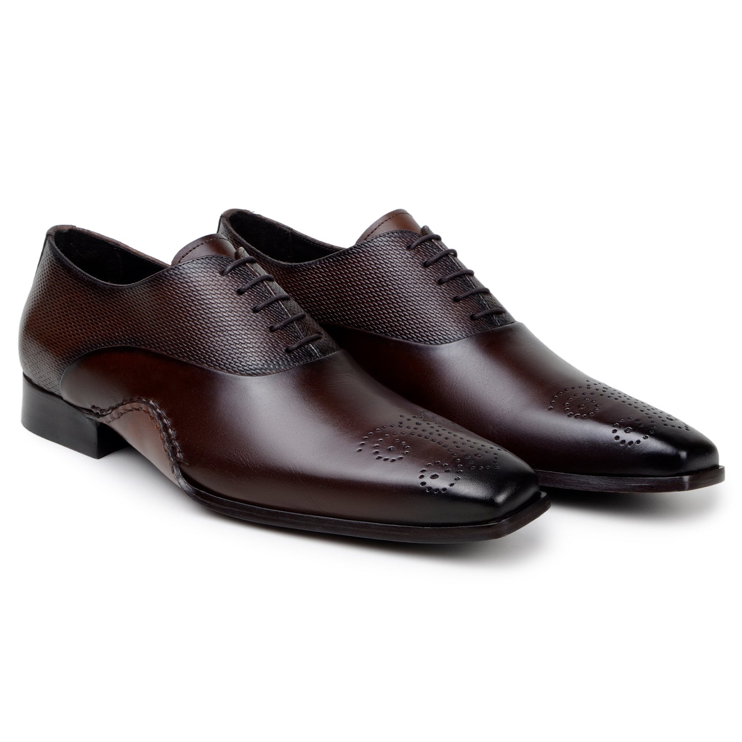 The BELVEDERE Saggio is an Ant. Tobacco Italian calf leather dress shoe with textured panels, toe perforations, a low heel, and handcrafted in Brazil with fine Opanka construction.