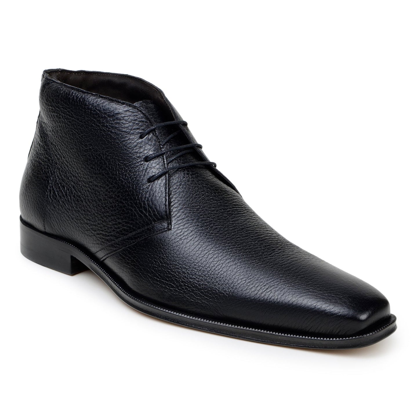 The BELVEDERE Axel is a black genuine Italian deerskin boot with a textured finish, minimal stitching, and a low heel, handcrafted in Brazil and shown in profile against a white background.