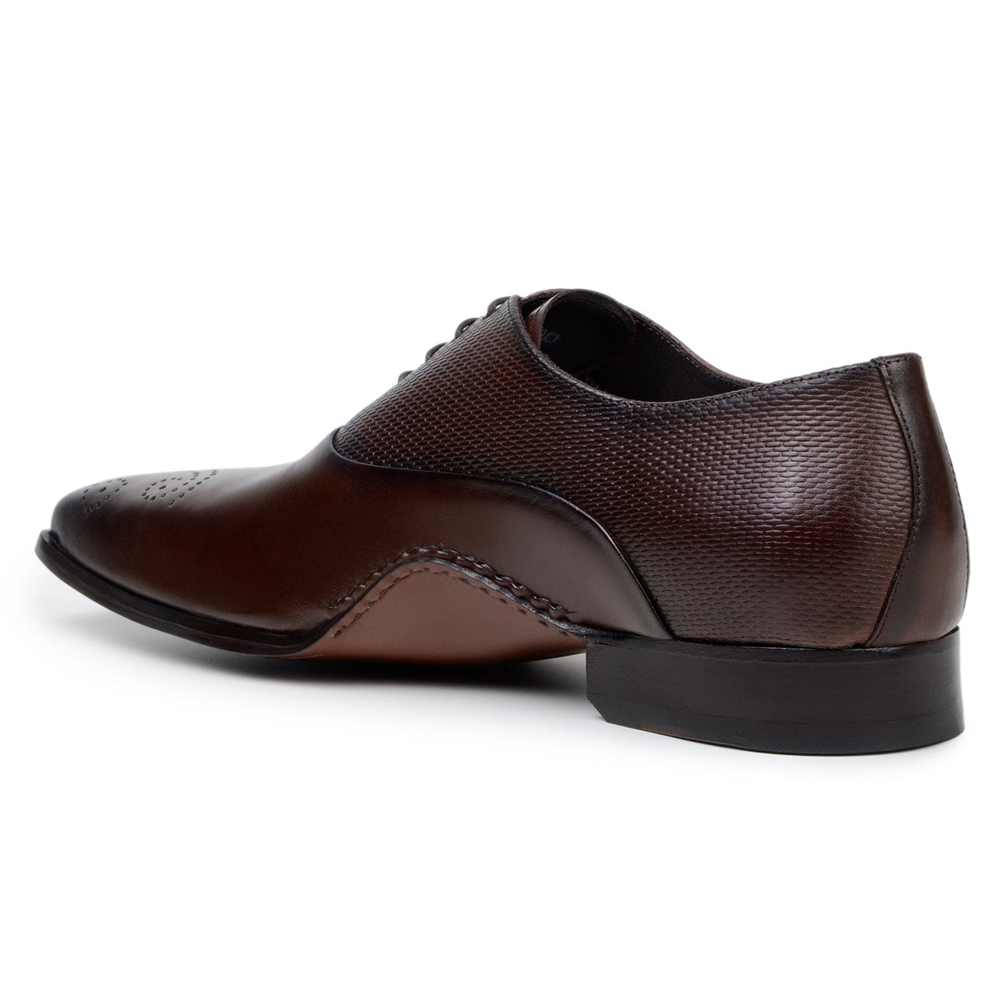 The BELVEDERE Saggio is an Ant. Tobacco Italian calf leather dress shoe with textured panels, toe perforations, a low heel, and handcrafted in Brazil with fine Opanka construction.
