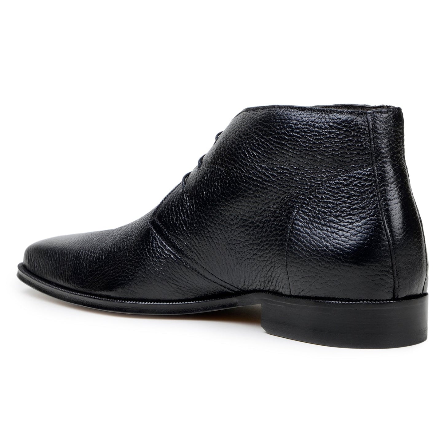The BELVEDERE Axel is a black genuine Italian deerskin boot with a textured finish, minimal stitching, and a low heel, handcrafted in Brazil and shown in profile against a white background.