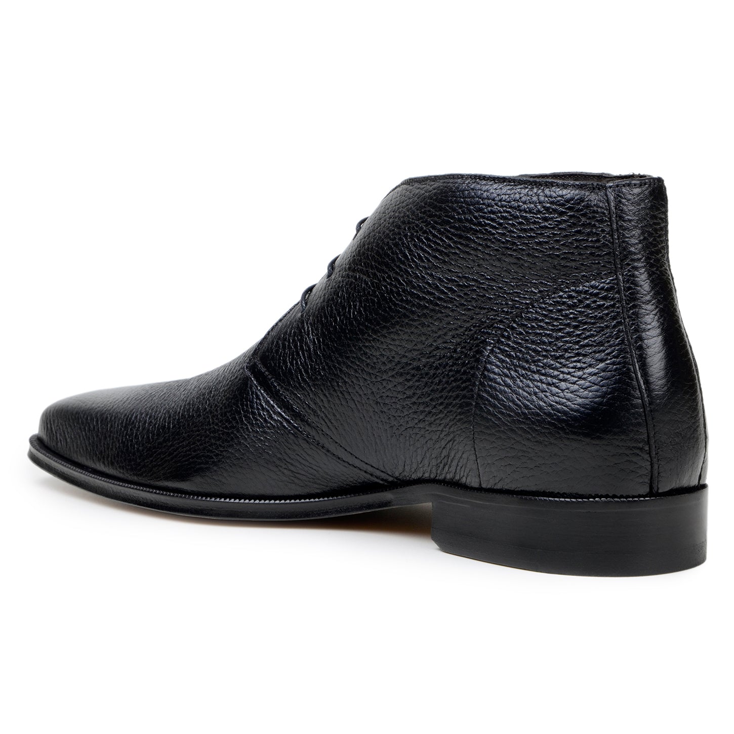 The BELVEDERE Axel is a black genuine Italian deerskin boot with a textured finish, minimal stitching, and a low heel, handcrafted in Brazil and shown in profile against a white background.