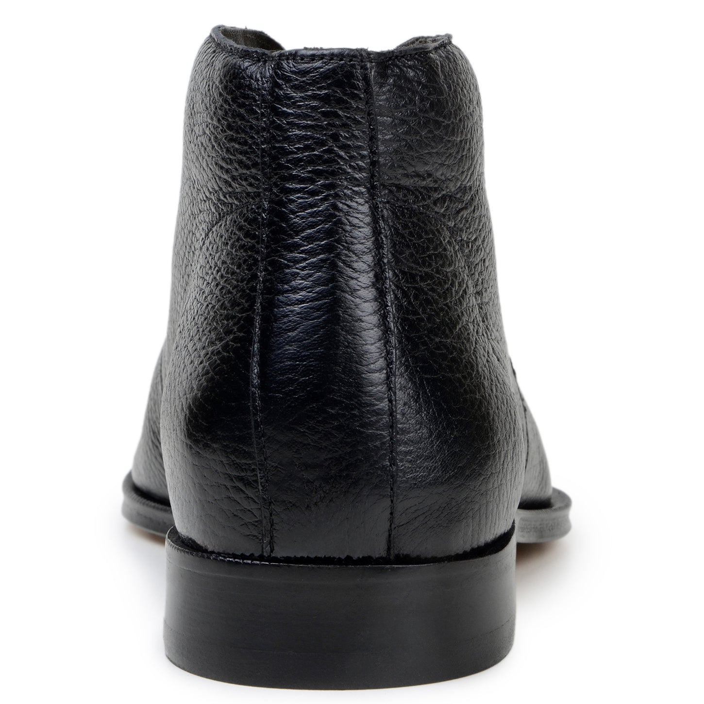 The BELVEDERE Axel is a black genuine Italian deerskin boot with a textured finish, minimal stitching, and a low heel, handcrafted in Brazil and shown in profile against a white background.
