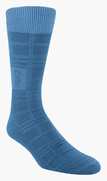 The Stacy Adams Tonal Plaid Antique Denim Socks from ORIGINS feature a textured checkered pattern in blue with a ribbed cuff against a white background, ideally crafted to fit men sizes 8-13.