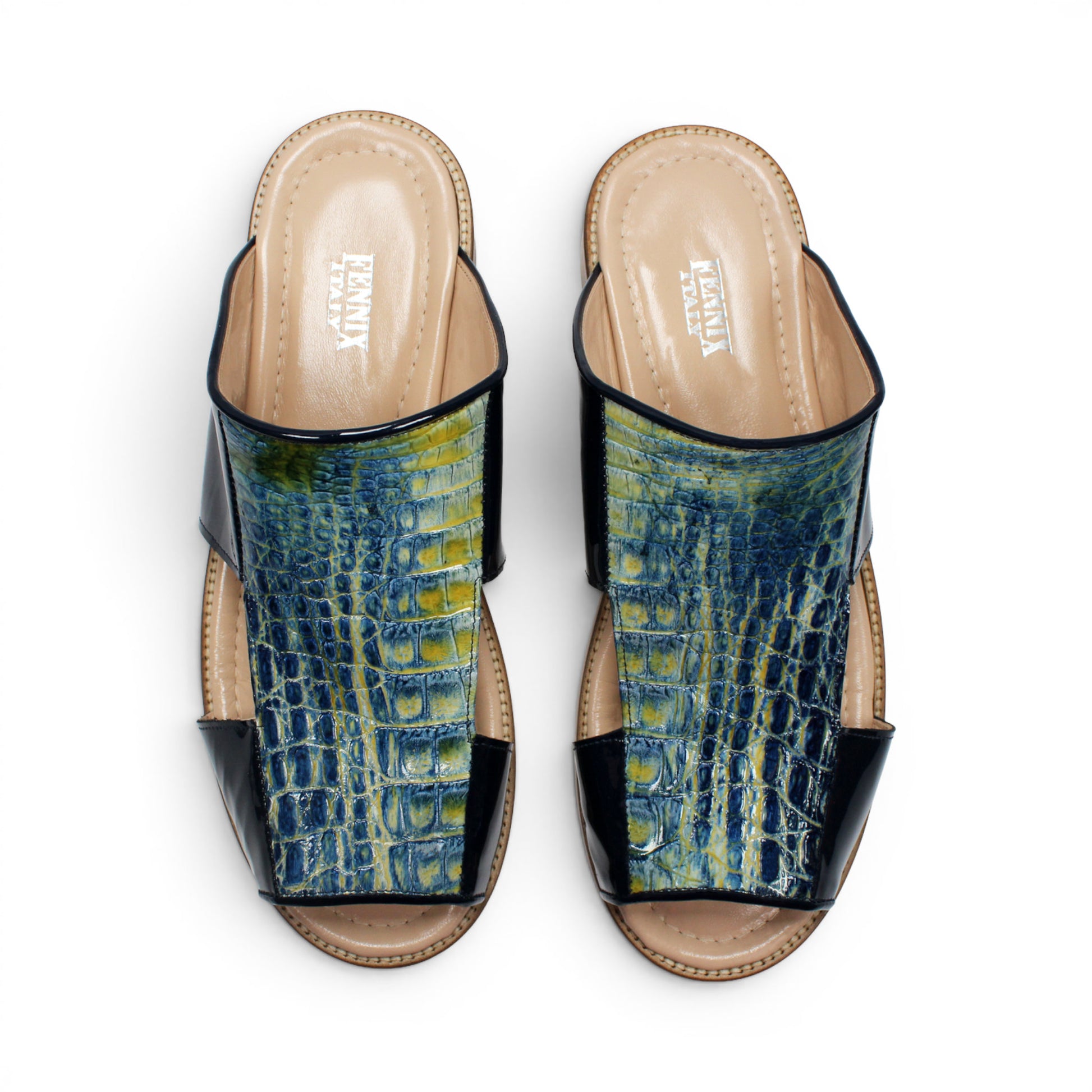A side view of the Fennix Diego Blue sandal by Fennix of Italy, featuring a wooden sole, black patent leather sides, and a textured blue upper with intricate cut-out detailing—exemplifying the exotic luxury typical of Italian craftsmanship.