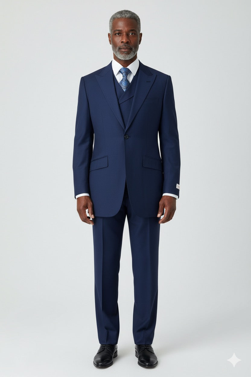 A timeless Tiglio Rosso San Giovesse Solid French Blue suit, made entirely from 100% wool, includes a coordinating vest and a chic blue patterned tie, artfully showcased on a mannequin.