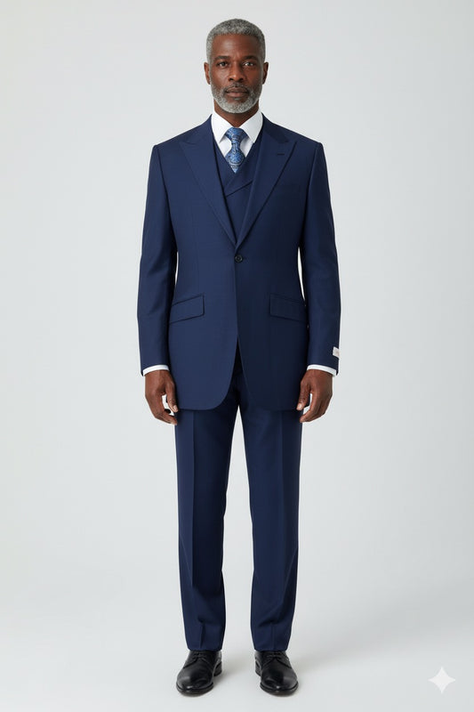 A timeless Tiglio Rosso San Giovesse Solid French Blue suit, made entirely from 100% wool, includes a coordinating vest and a chic blue patterned tie, artfully showcased on a mannequin.