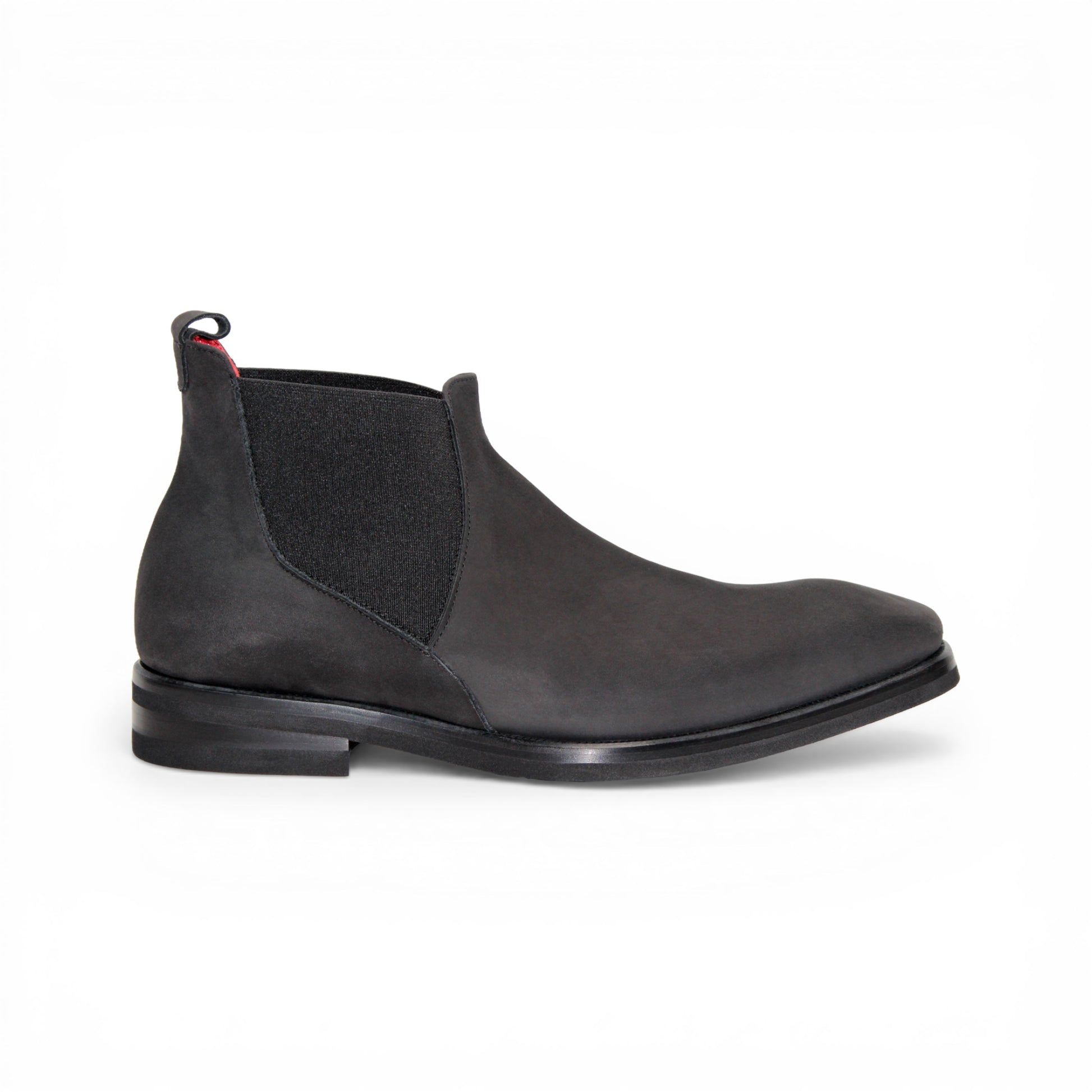 The Emilio Franco EF311 Black by Emilio Franco is a black leather Chelsea boot, featuring an elastic side panel and a low heel, shown in profile against a white background to showcase its casual elegance. Handcrafted in Italy and inspired by genuine Italian nabuk shoes, this versatile design blends timeless style with impeccable craftsmanship.