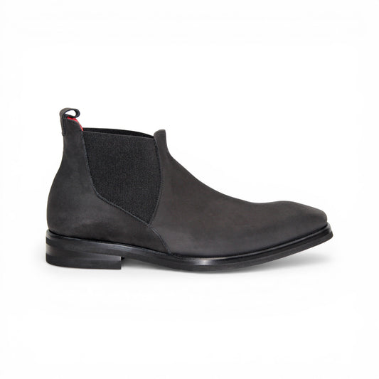 The Emilio Franco EF311 Black by Emilio Franco is a black leather Chelsea boot, featuring an elastic side panel and a low heel, shown in profile against a white background to showcase its casual elegance. Handcrafted in Italy and inspired by genuine Italian nabuk shoes, this versatile design blends timeless style with impeccable craftsmanship.