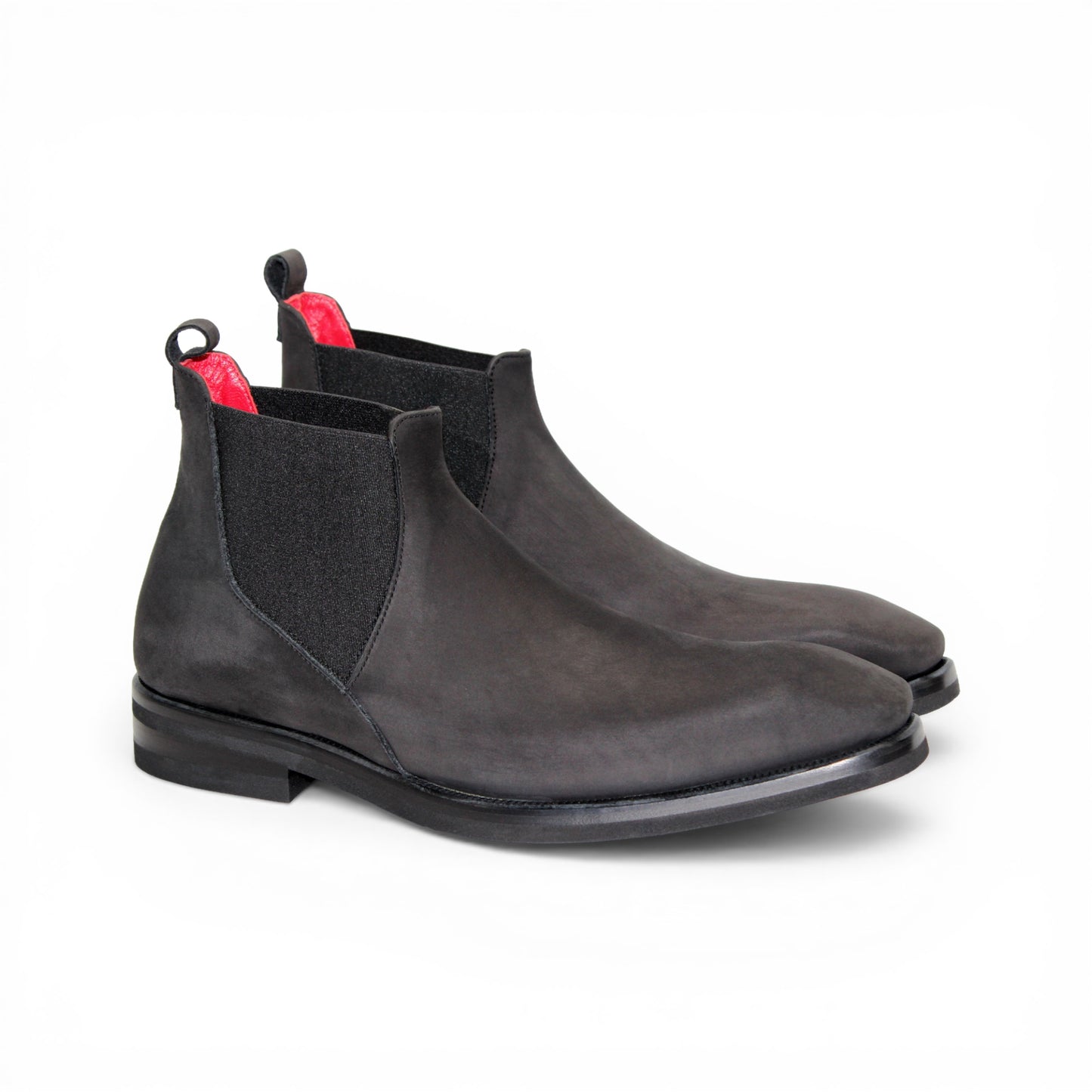 The Emilio Franco EF311 Black by Emilio Franco is a black leather Chelsea boot, featuring an elastic side panel and a low heel, shown in profile against a white background to showcase its casual elegance. Handcrafted in Italy and inspired by genuine Italian nabuk shoes, this versatile design blends timeless style with impeccable craftsmanship.