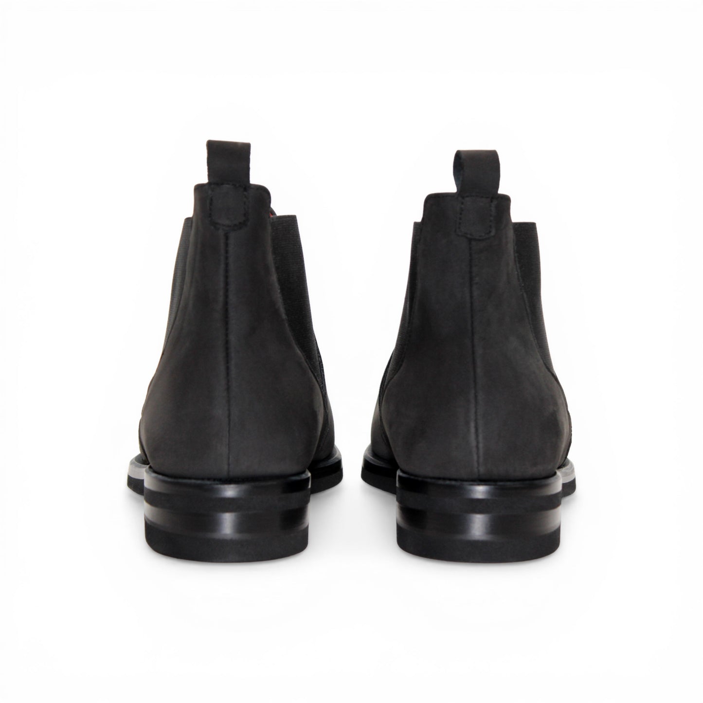 The Emilio Franco EF311 Black by Emilio Franco is a black leather Chelsea boot, featuring an elastic side panel and a low heel, shown in profile against a white background to showcase its casual elegance. Handcrafted in Italy and inspired by genuine Italian nabuk shoes, this versatile design blends timeless style with impeccable craftsmanship.