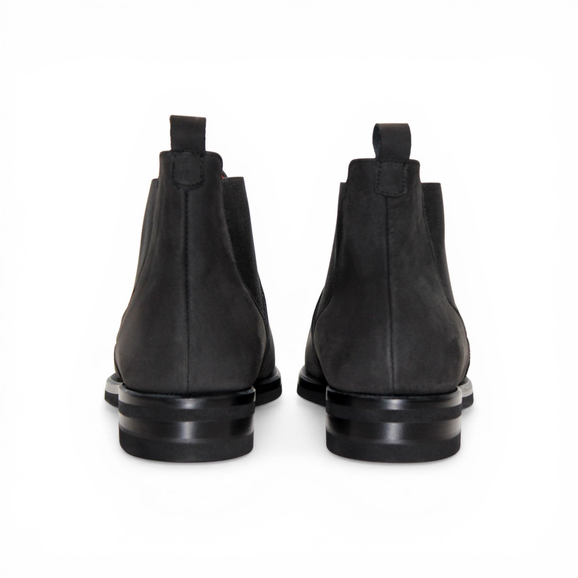 The Emilio Franco EF311 Black by Emilio Franco is a black leather Chelsea boot, featuring an elastic side panel and a low heel, shown in profile against a white background to showcase its casual elegance. Handcrafted in Italy and inspired by genuine Italian nabuk shoes, this versatile design blends timeless style with impeccable craftsmanship.