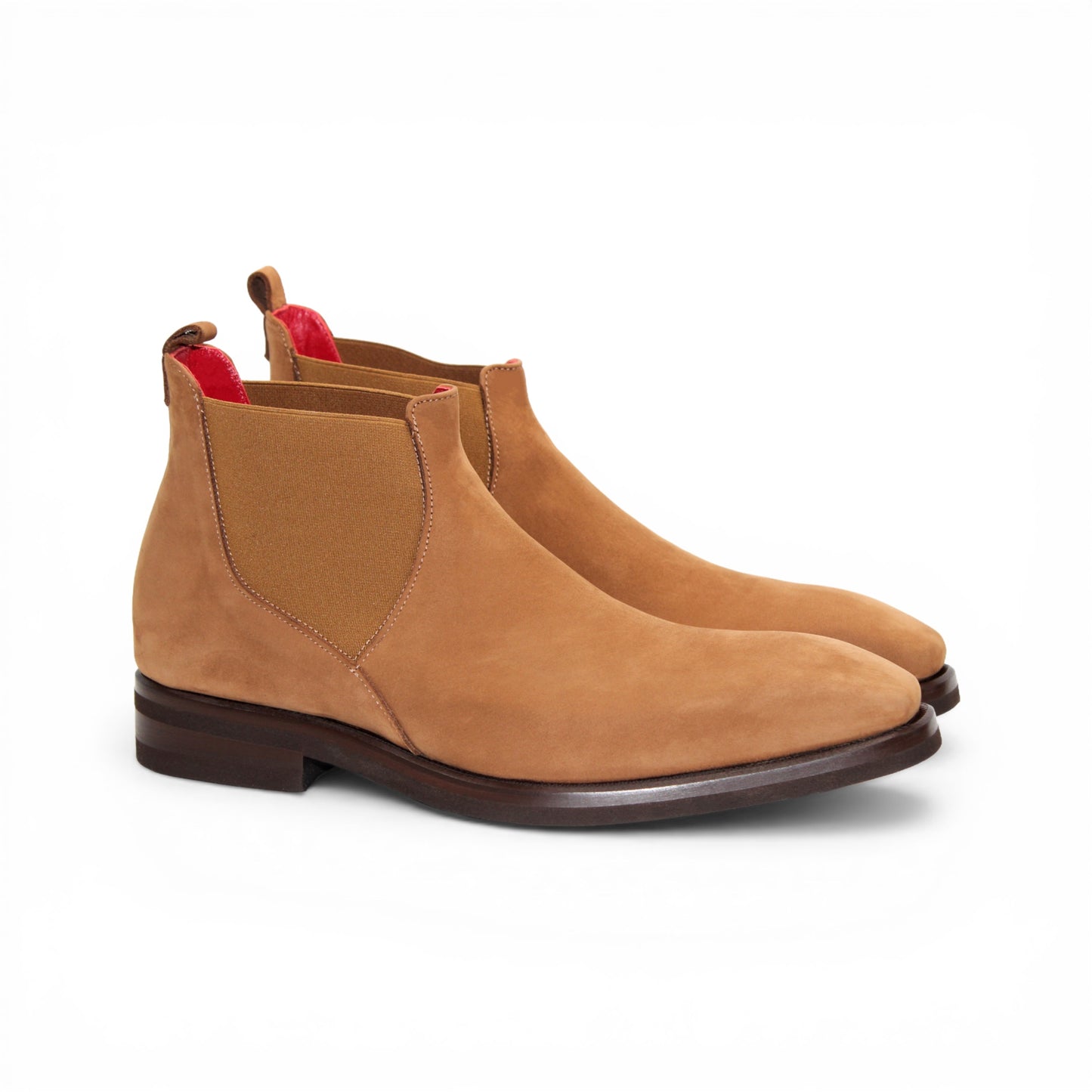 The Emilio Franco EF311 Camel by Emilio Franco is a tan suede Chelsea boot, handcrafted in Italy with an elastic side panel, a dark brown sole, and red trim detail—an expression of casual elegance, shown in profile against a white background.