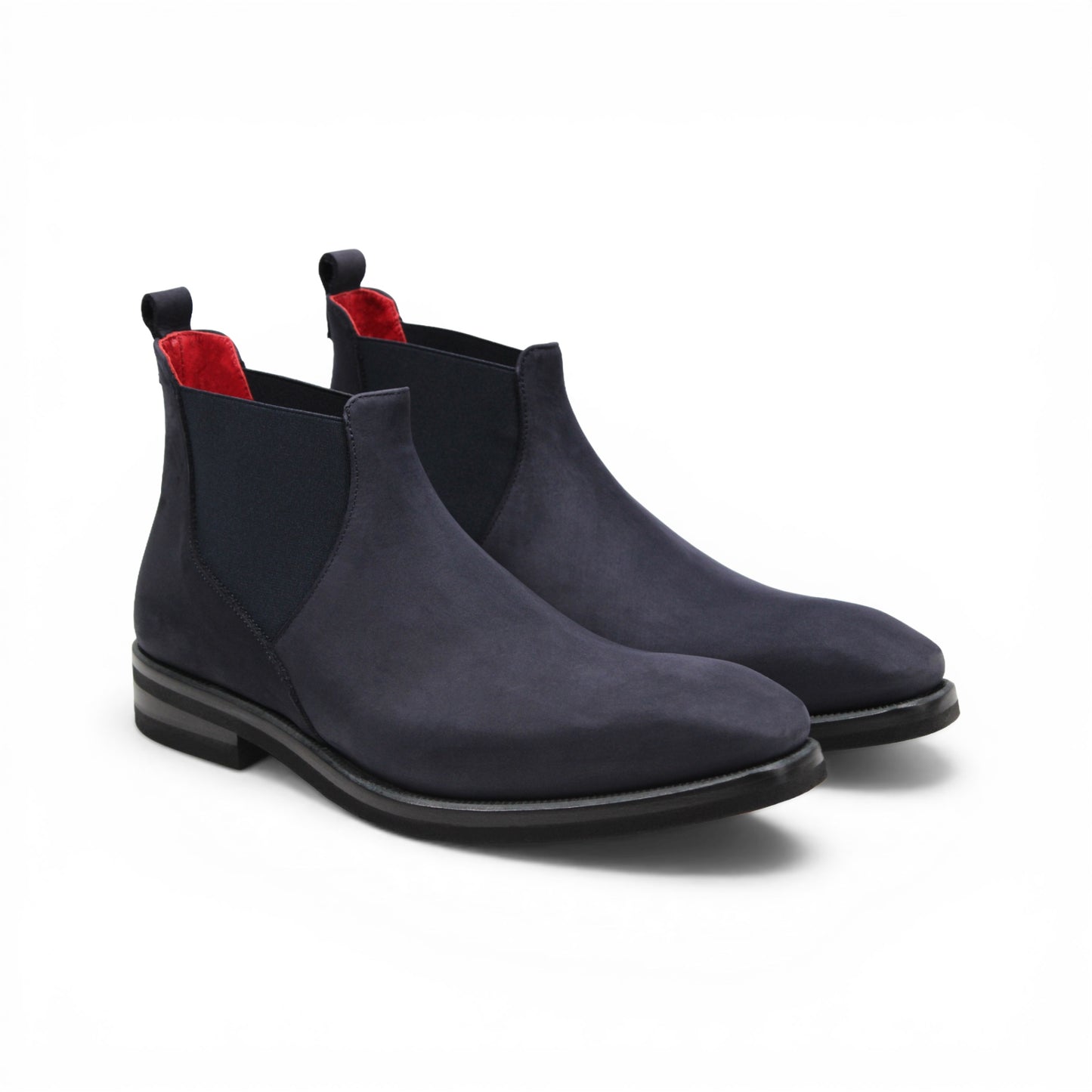 Introducing the Emilio Franco EF311 Navy by Emilio Franco — a meticulously handcrafted Chelsea boot in navy blue suede, featuring a black sole, elastic side panels, a convenient heel pull tab, and a subtle red lining. Expertly made in Italy, it exudes casual elegance and superior quality.