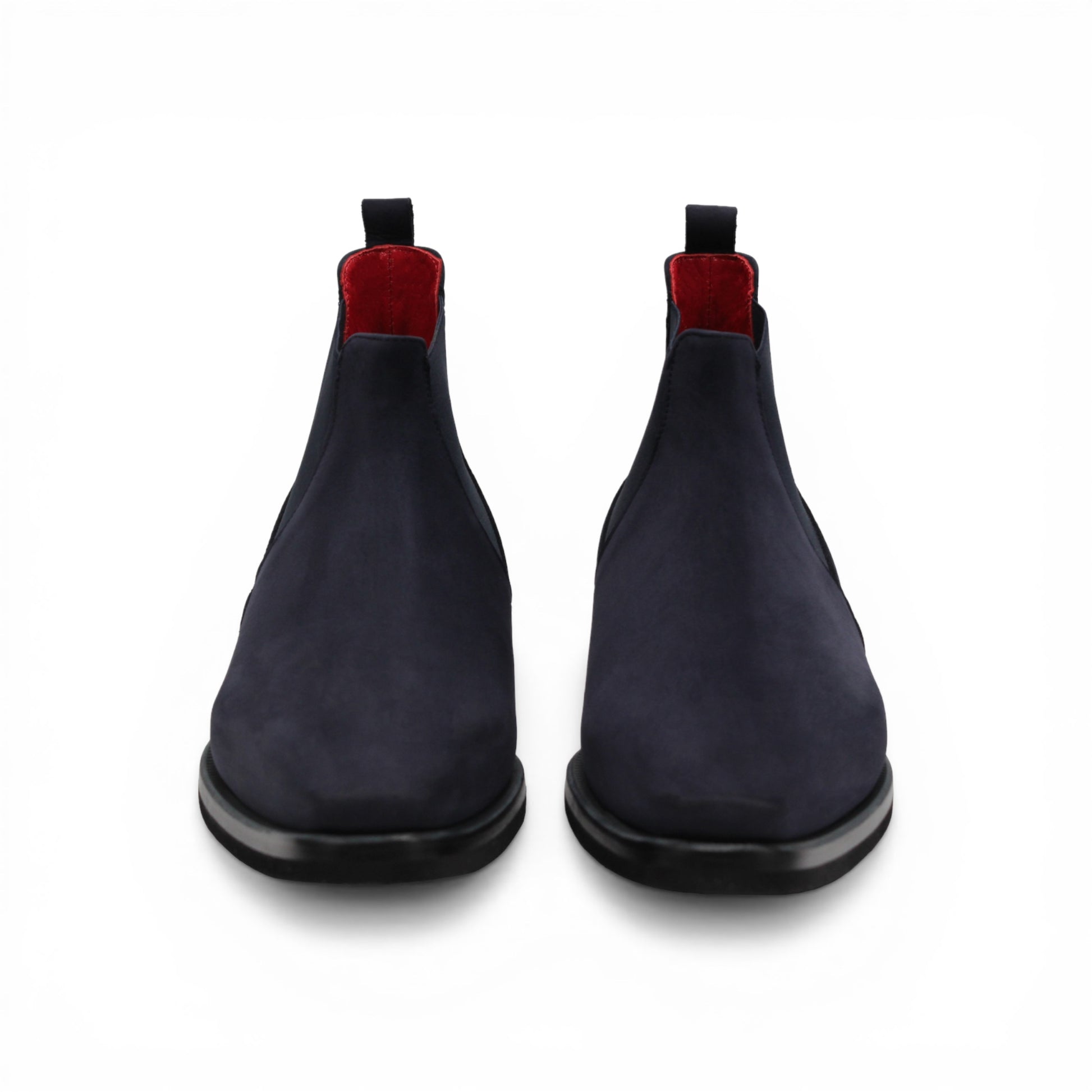 Introducing the Emilio Franco EF311 Navy by Emilio Franco — a meticulously handcrafted Chelsea boot in navy blue suede, featuring a black sole, elastic side panels, a convenient heel pull tab, and a subtle red lining. Expertly made in Italy, it exudes casual elegance and superior quality.