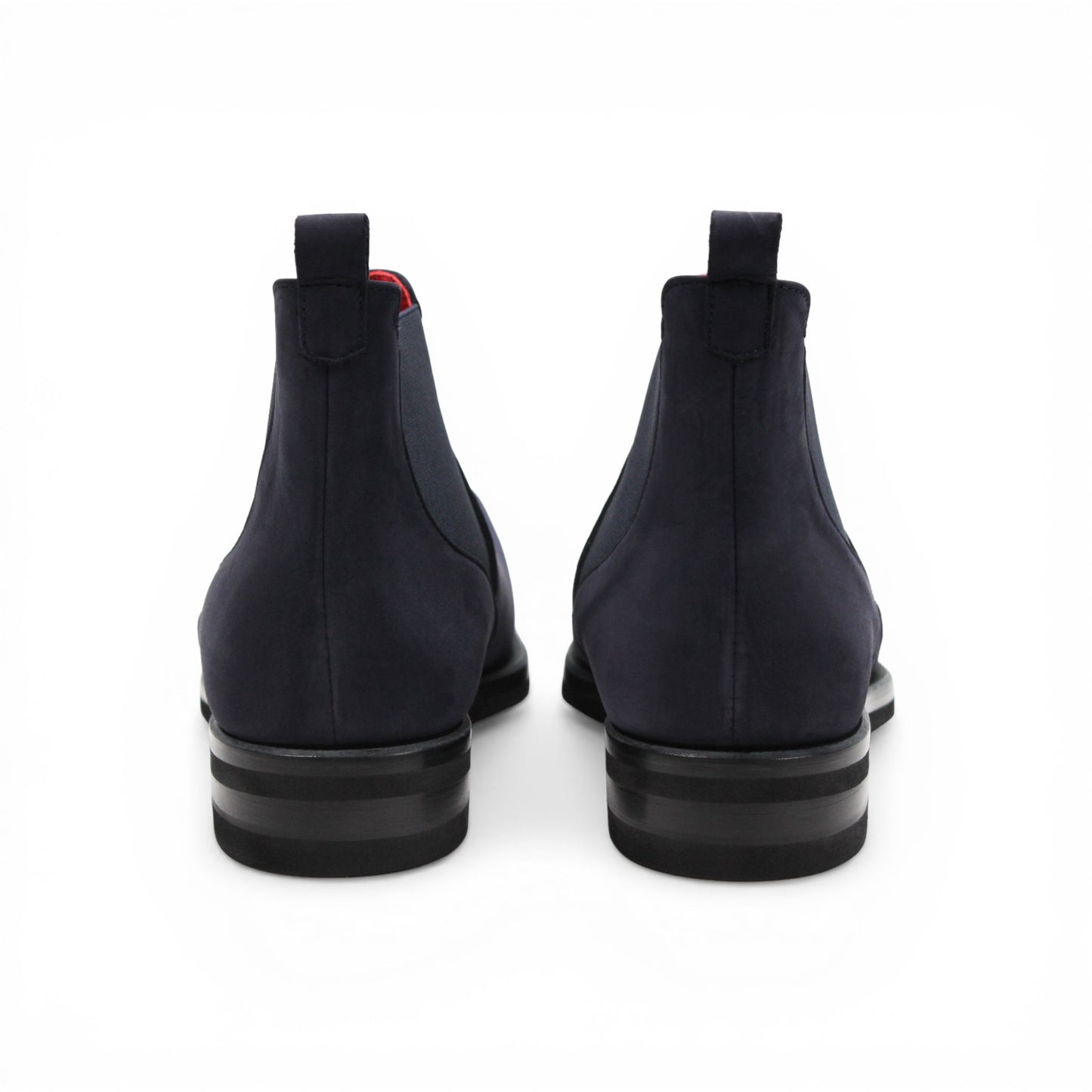 Introducing the Emilio Franco EF311 Navy by Emilio Franco — a meticulously handcrafted Chelsea boot in navy blue suede, featuring a black sole, elastic side panels, a convenient heel pull tab, and a subtle red lining. Expertly made in Italy, it exudes casual elegance and superior quality.