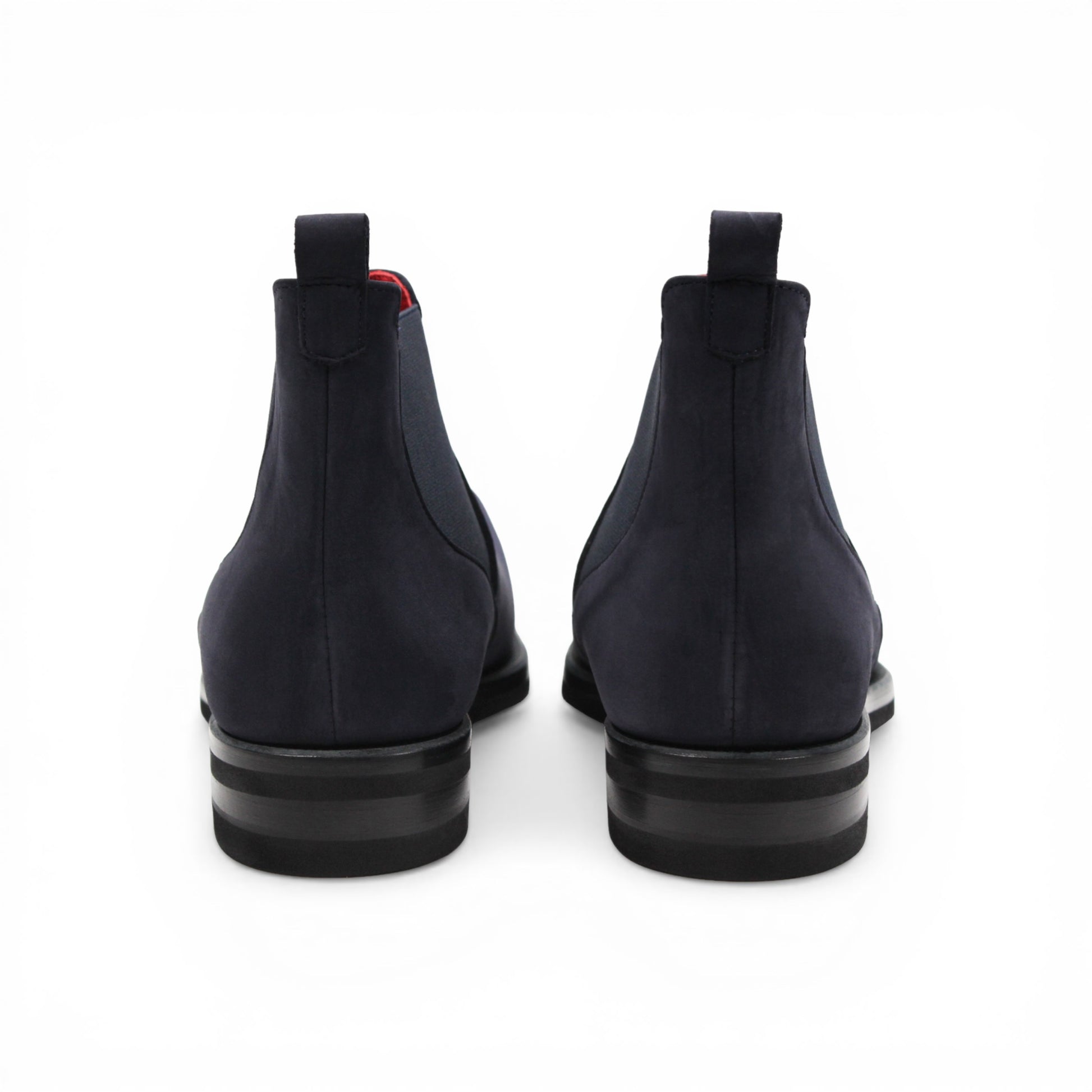 Introducing the Emilio Franco EF311 Navy by Emilio Franco — a meticulously handcrafted Chelsea boot in navy blue suede, featuring a black sole, elastic side panels, a convenient heel pull tab, and a subtle red lining. Expertly made in Italy, it exudes casual elegance and superior quality.