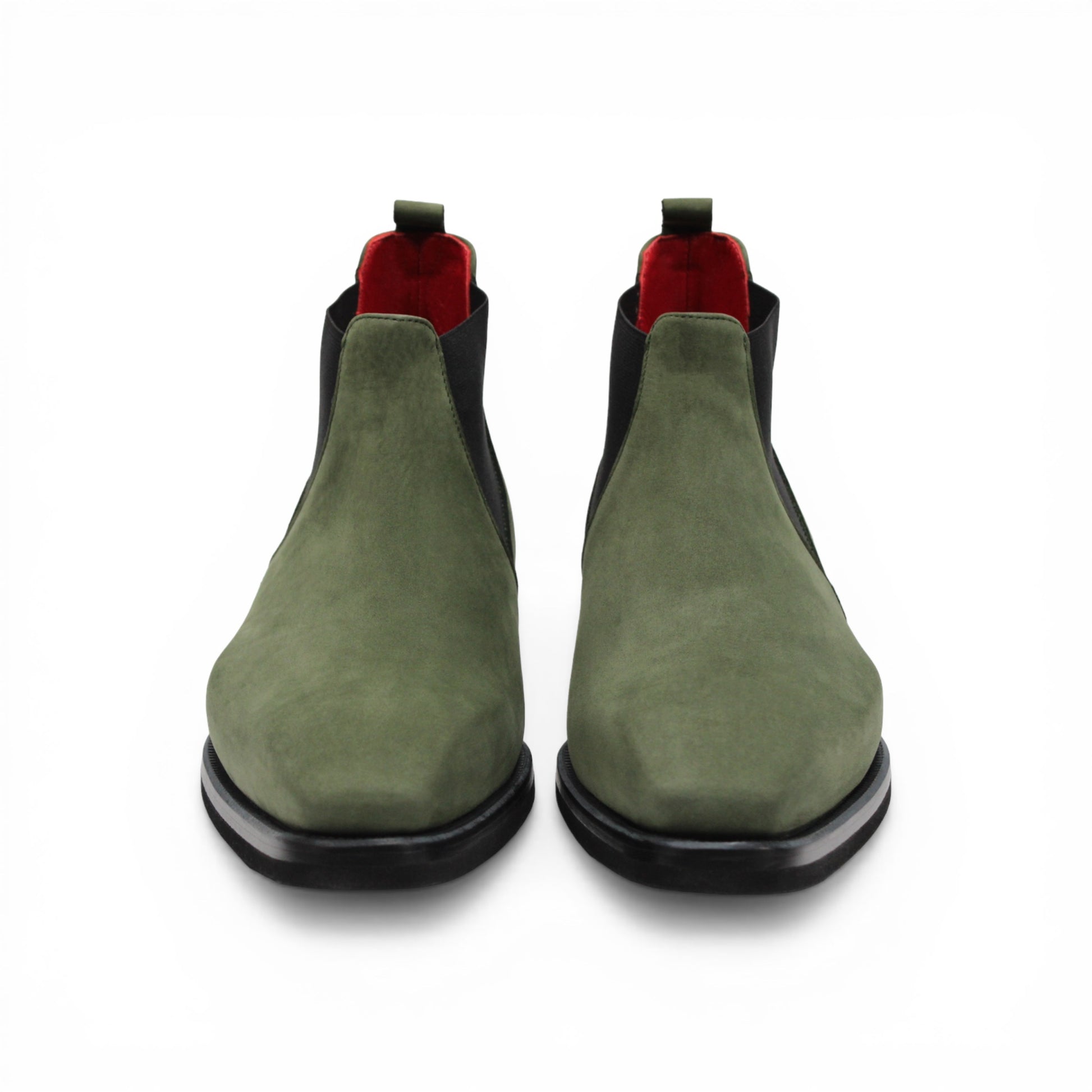 The Emilio Franco EF311 Olive is a green leather Chelsea boot crafted from genuine Italian nabuk, featuring black elastic side panels, a black sole, and a red pull tab at the heel. Presented in profile on a white background, this shoe by Emilio Franco effortlessly blends casual elegance with timeless style.