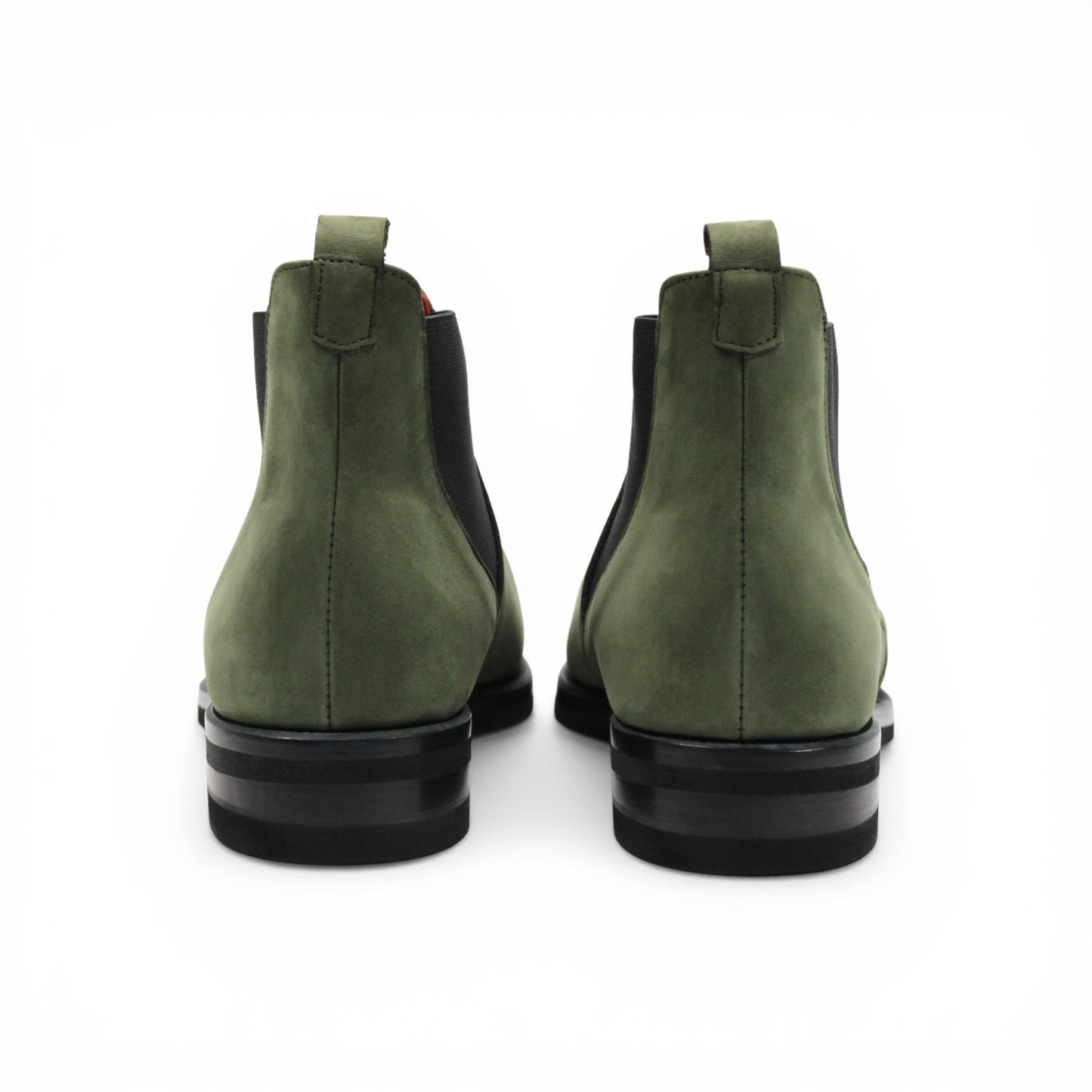 The Emilio Franco EF311 Olive is a green leather Chelsea boot crafted from genuine Italian nabuk, featuring black elastic side panels, a black sole, and a red pull tab at the heel. Presented in profile on a white background, this shoe by Emilio Franco effortlessly blends casual elegance with timeless style.