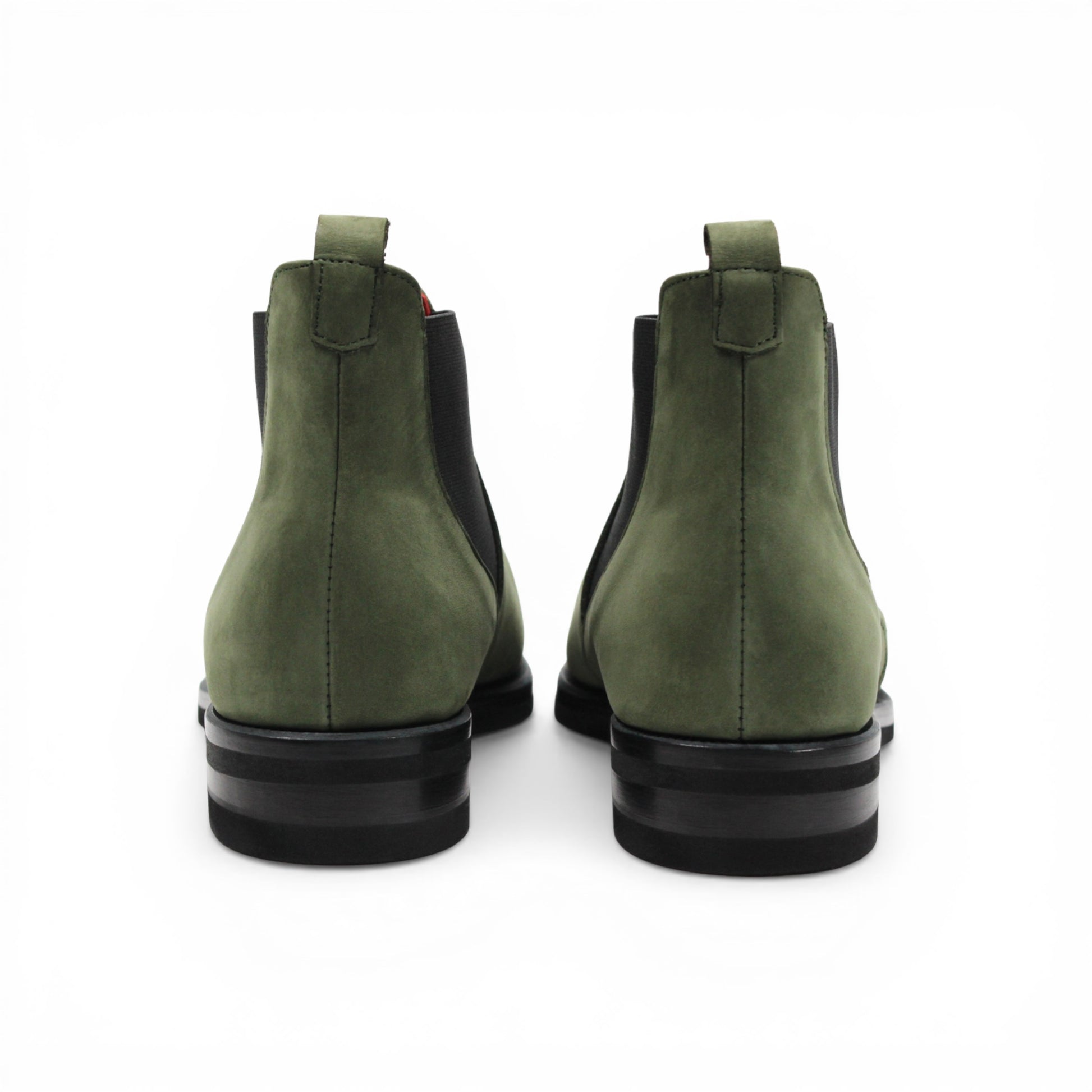 The Emilio Franco EF311 Olive is a green leather Chelsea boot crafted from genuine Italian nabuk, featuring black elastic side panels, a black sole, and a red pull tab at the heel. Presented in profile on a white background, this shoe by Emilio Franco effortlessly blends casual elegance with timeless style.