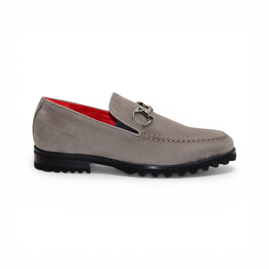 The Emilio Franco EF363 Gray loafer is expertly crafted from Genuine Nabuk in a sophisticated gray hue. It features a black rubber sole, silver buckle accent, and striking red interior lining. Displayed in a side profile against a white background, this classic Italian shoe by Emilio Franco embodies refined elegance.
