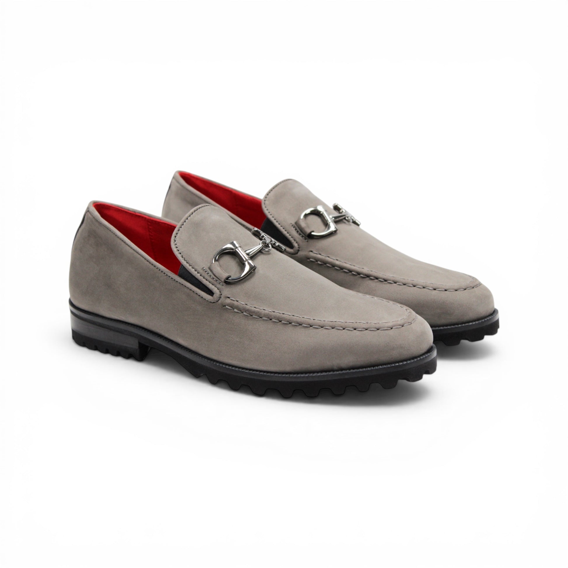 The Emilio Franco EF363 Gray loafer is expertly crafted from Genuine Nabuk in a sophisticated gray hue. It features a black rubber sole, silver buckle accent, and striking red interior lining. Displayed in a side profile against a white background, this classic Italian shoe by Emilio Franco embodies refined elegance.