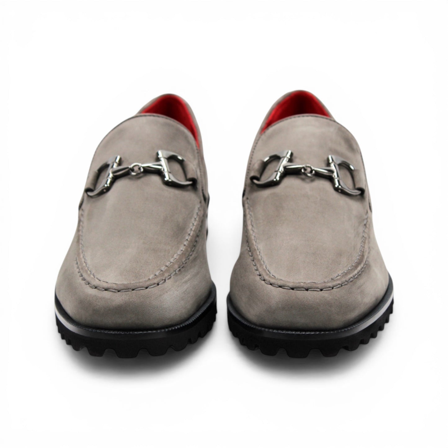 The Emilio Franco EF363 Gray loafer is expertly crafted from Genuine Nabuk in a sophisticated gray hue. It features a black rubber sole, silver buckle accent, and striking red interior lining. Displayed in a side profile against a white background, this classic Italian shoe by Emilio Franco embodies refined elegance.