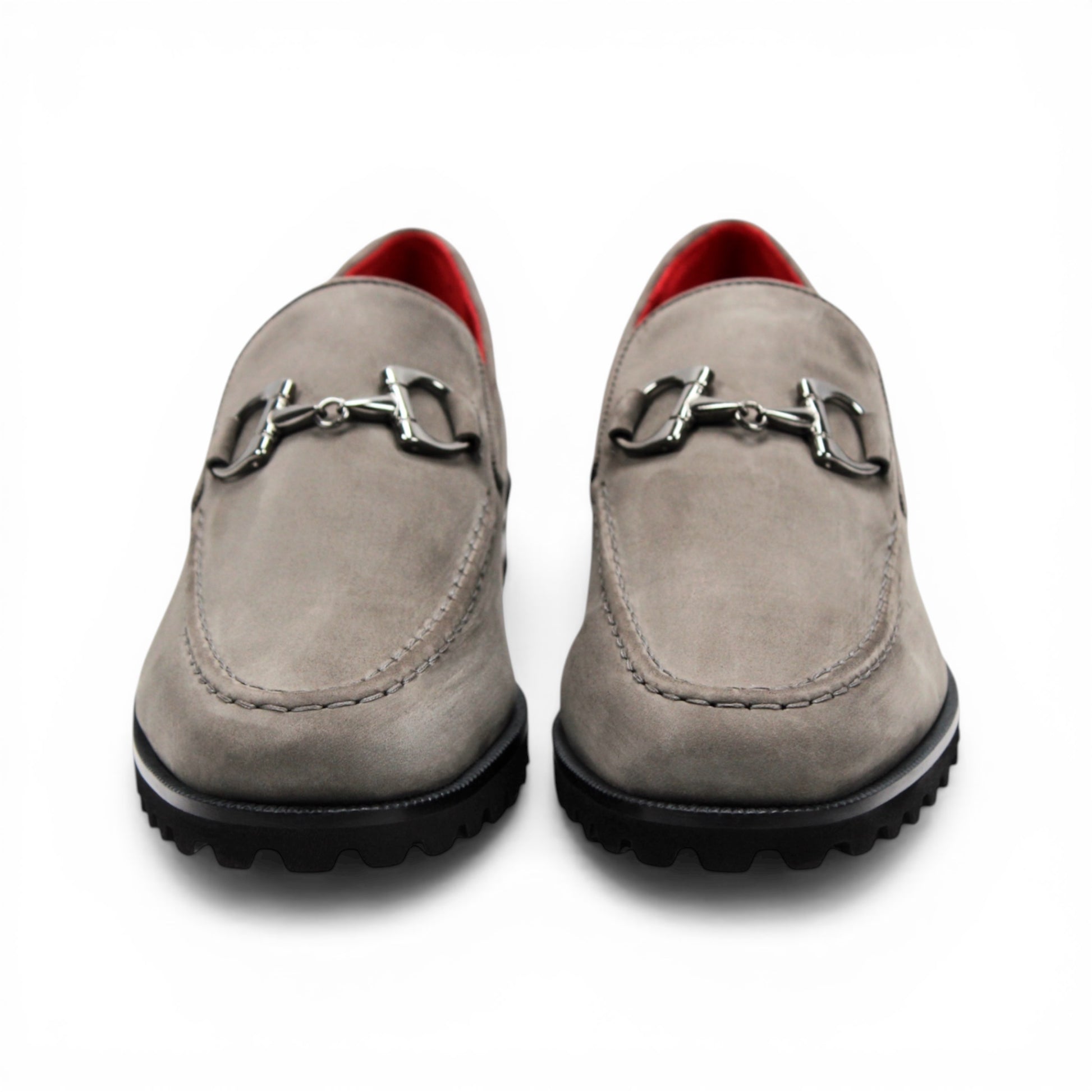 The Emilio Franco EF363 Gray loafer is expertly crafted from Genuine Nabuk in a sophisticated gray hue. It features a black rubber sole, silver buckle accent, and striking red interior lining. Displayed in a side profile against a white background, this classic Italian shoe by Emilio Franco embodies refined elegance.