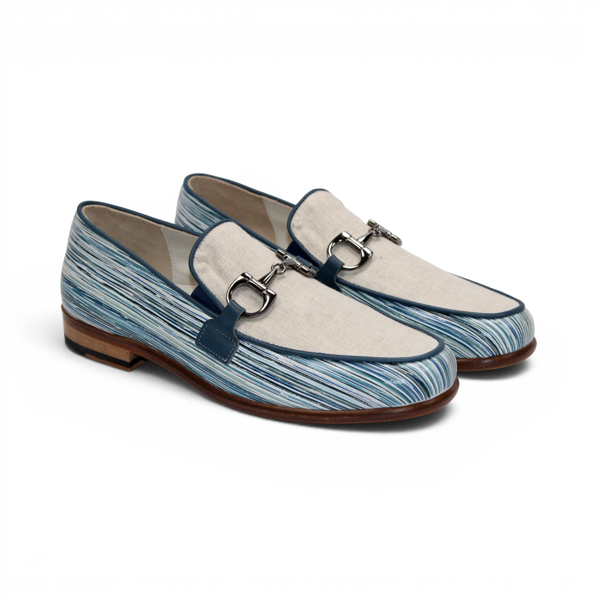 Introducing the Emilio Franco EF439 Blue by Emilio Franco—a luxury men's loafer crafted in Italy. This elegant shoe features a distinctive blue and white patterned calf print leather, complemented by a beige upper section, metal buckle detail, and a brown sole. The footwear is presented in side profile against a white background.