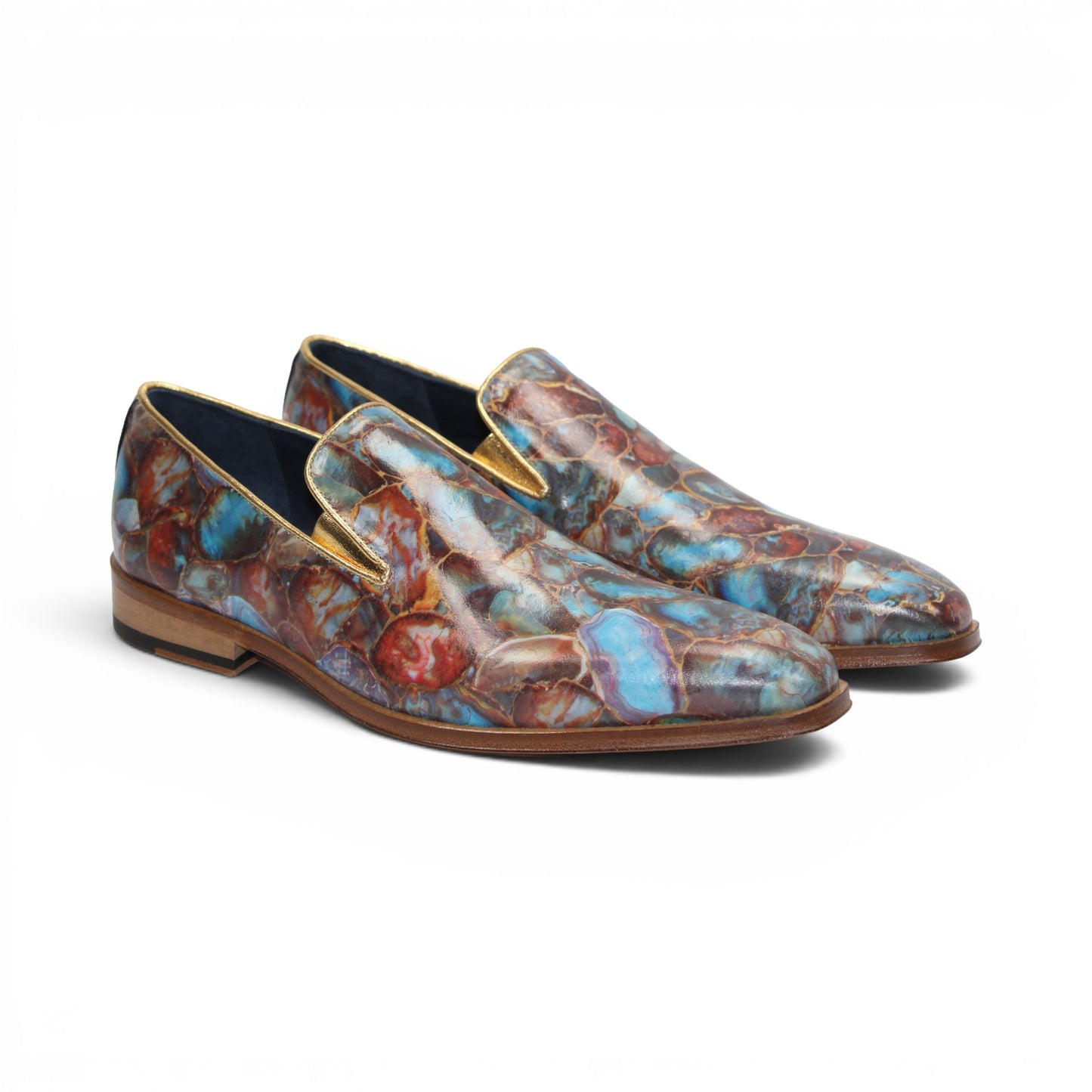 The Emilio Franco EF483 Marble by Emilio Franco is a loafer-style dress shoe showcasing a multicolored, abstract marble calf print in blue, red, and brown tones. It features a low wooden heel, leather sole, and slip-on design—an impressive display of Italian footwear craftsmanship.