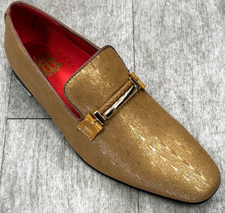 The Exclusive Formal Dress Shoe Gold 6993 from UNIQUE DESIGN MENSWEAR is a golden slip-on with a shiny, suede leather texture and a decorative metal buckle, shown on a gray tiled floor.