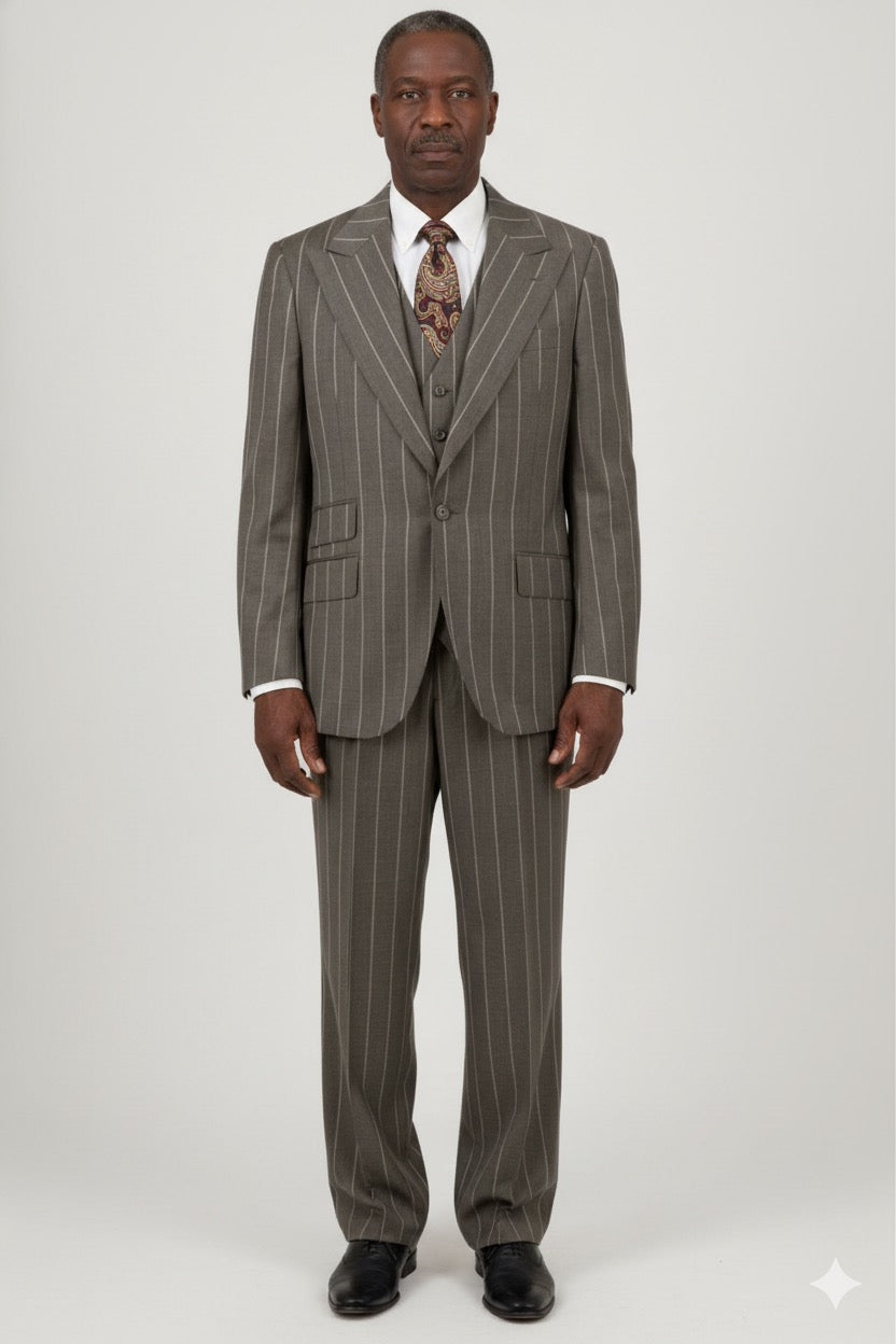 The Tiglio Rosso Orvietto Taupe Pinstripe Semi Wide Leg TL5065 suit, made from 100% wool, includes a single-breasted jacket and matching trousers, stylishly presented on a white backdrop.