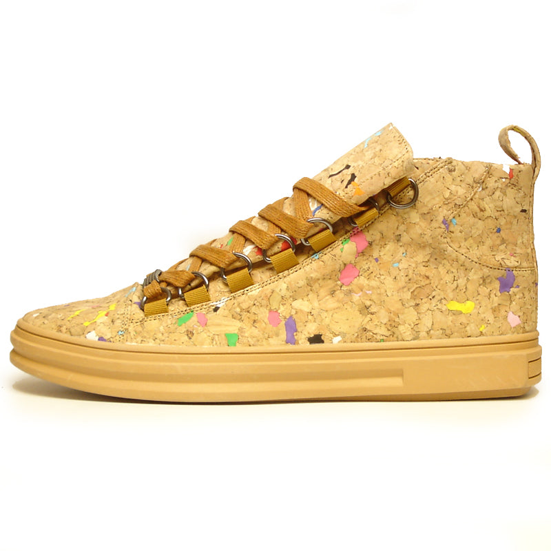 The FI-2254 Brown Casual High Top Sneaker Boot Encore by Fiesso features cork-textured vegan leather, yellow-brown laces, and colorful specks—eye-catching men's fashion sneakers set against a plain white background.